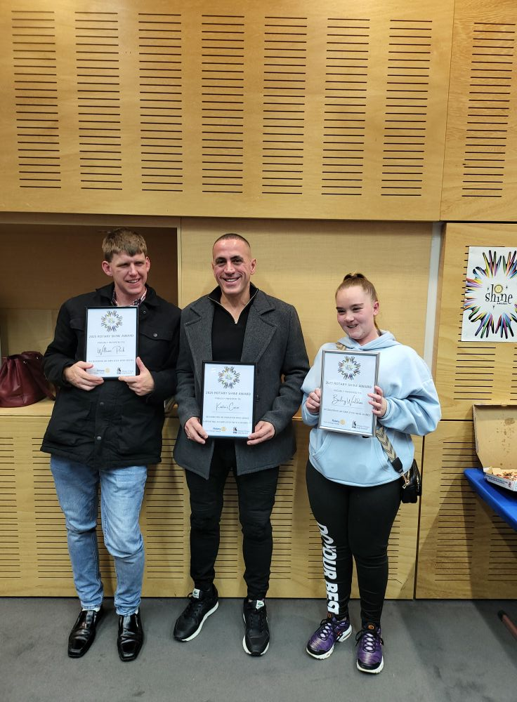 Crew members holding Rotary Shine Awards
